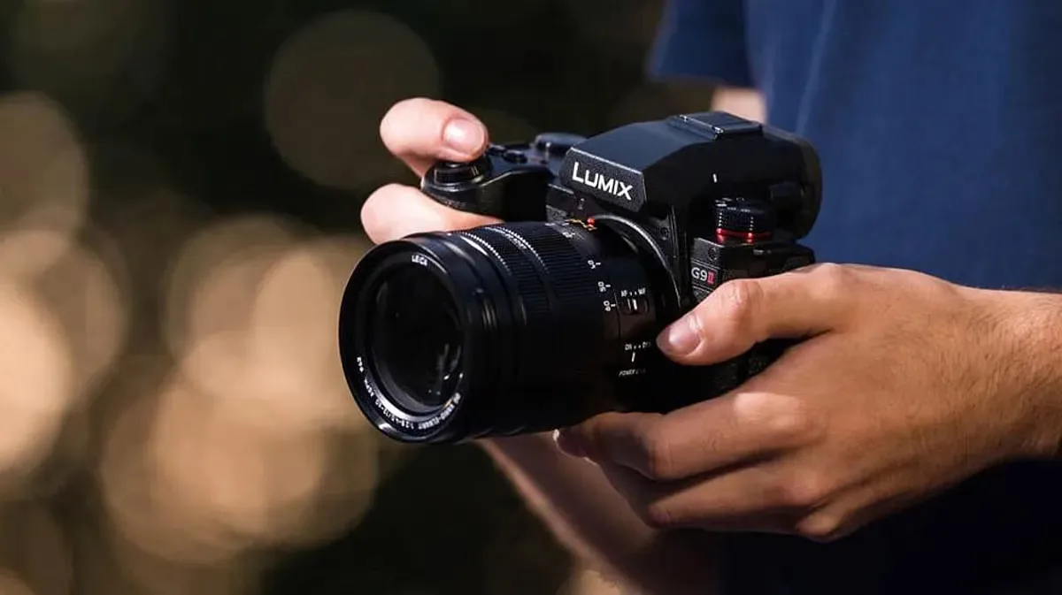 Professional photographer shooting a product setup with softboxes and a tethered laptop